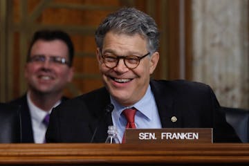 Senate Energy and Natural Resources Committee member Sen. Al Franken, D-Minn. laughs as he asks questions of and jokes with Energy Secretary-designate