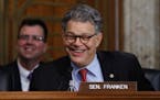 Senate Energy and Natural Resources Committee member Sen. Al Franken, D-Minn. laughs as he asks questions of and jokes with Energy Secretary-designate