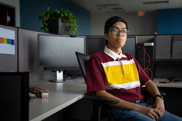 Anthony Tabura, at his new job at SRF Consulting in St. Paul on Friday. Tabura, a recent graduate of the U, is working to pay off $27,000 of student l