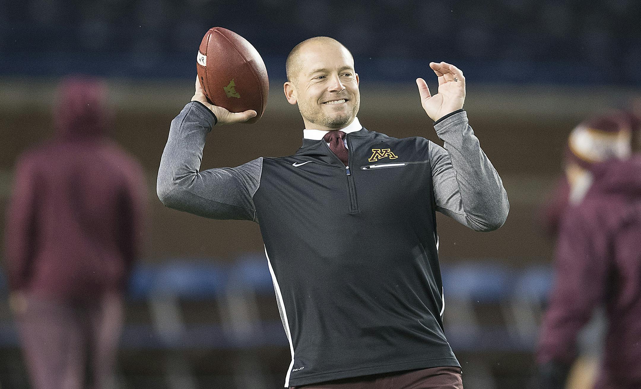 Minnesota Head Coach P. J. Fleck passed the ball a bit with his wife Heather Fleck before the Gophers took on Michigan in Michigan Stadium, Saturday, November 4, 2017 in Ann Arbor, MI. ] ELIZABETH FLORES ï liz.flores@startribune.com