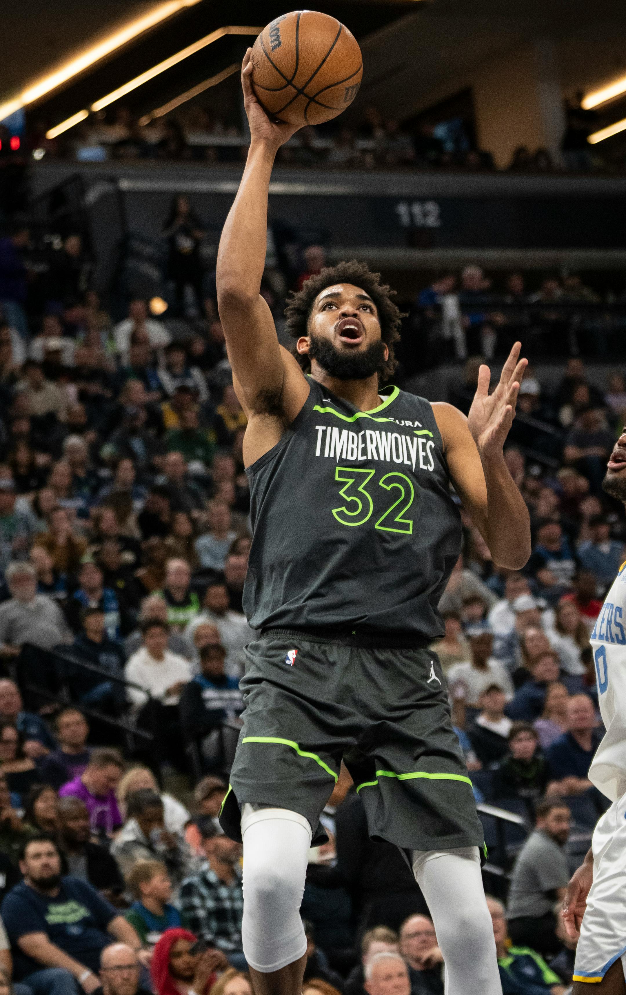 Minnesota Timberwolves center Karl-Anthony Towns (32) jumps for a shot attempt in the third quarter.