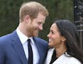 Britain's Prince Harry and Meghan Markle smile as they pose for the media in the grounds of Kensington Palace in London, Monday Nov. 27, 2017. It was 