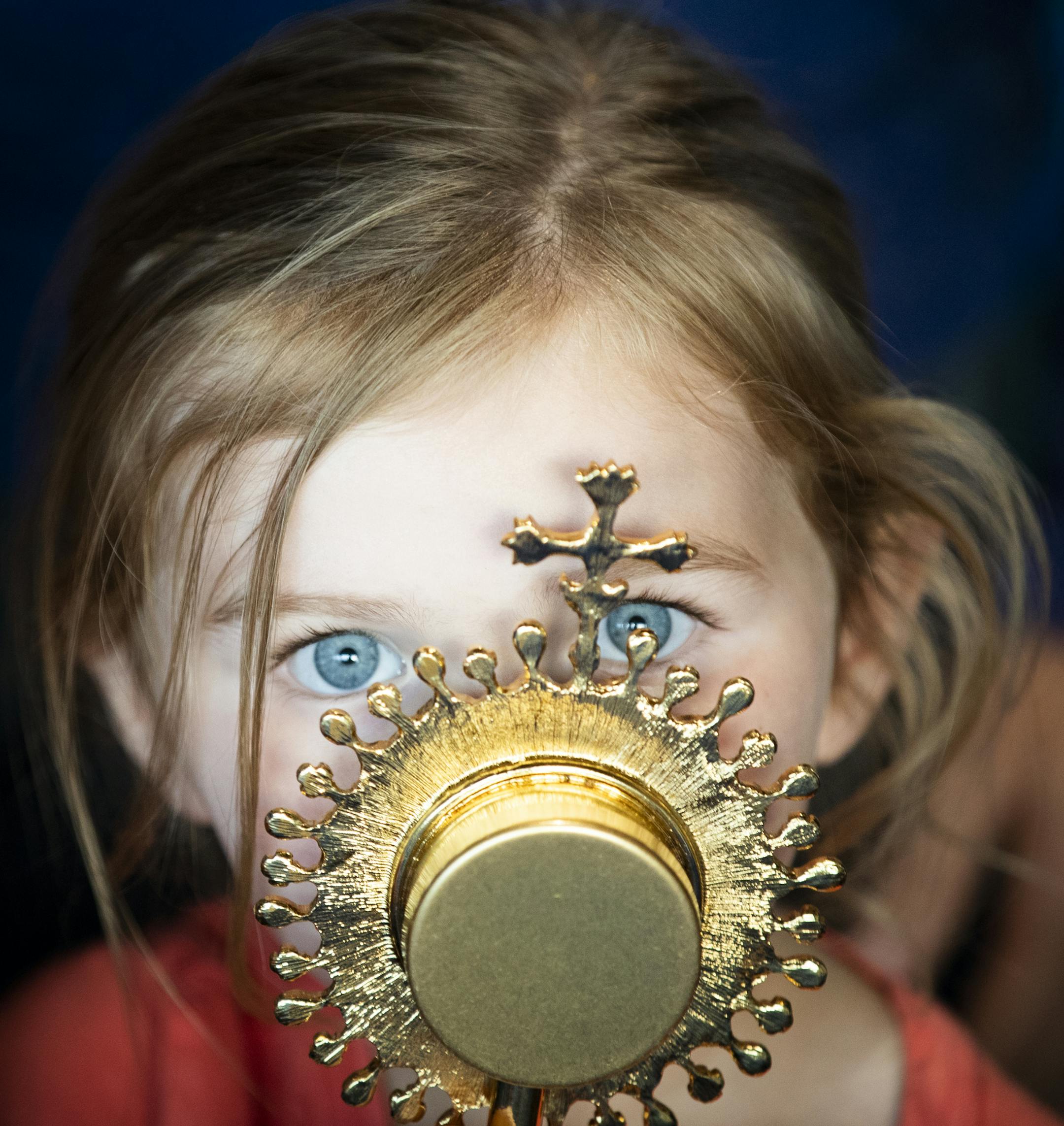 Pearl Sandquist, 3, of Chanhassen kisses a relic of St. Francis of Assisi. ] LEILA NAVIDI ï leila.navidi@startribune.com BACKGROUND INFORMATION: Treasures of the Church visits St. John the Baptist Catholic Parish in Excelsior on Wednesday, May 30, 2018. Treasures of the Church is a traveling exposition that gives parishioners a chance to venerate the relics of some of their favorite saints.