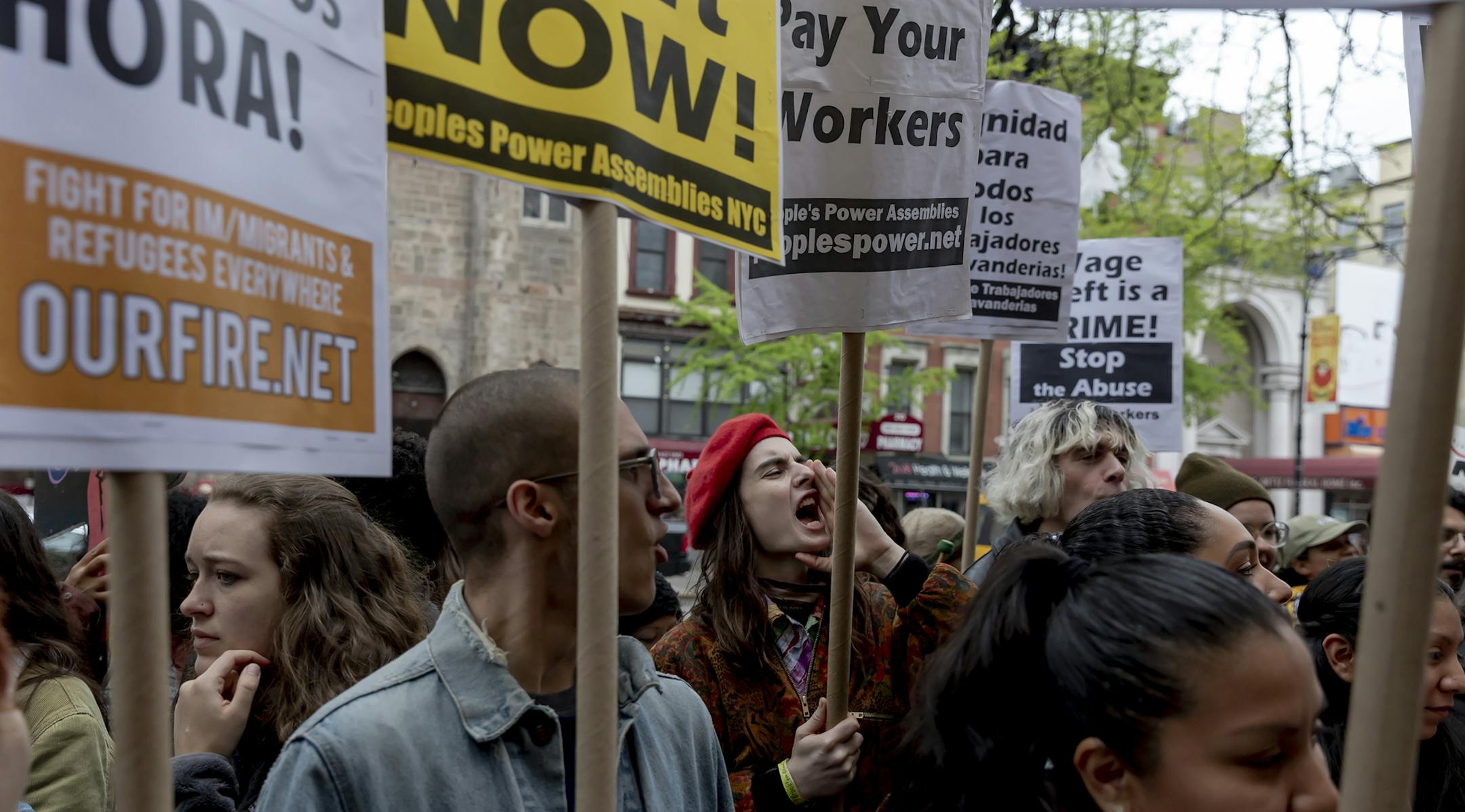 Protesters outside TYS Laundromat in East Harlem, on May 1, 2019. A survey conducted by the Laundry Workers Center found that one in five workers was paid below minimum wage, while 36 percent of them did not receive proper overtime compensation. For some immigrants, owning a laundry can be a path to prosperity. But their employees, also immigrants, can get caught in a spiral of low wages, poor working conditions and social isolation. (Mark Abramson/The New York Times)