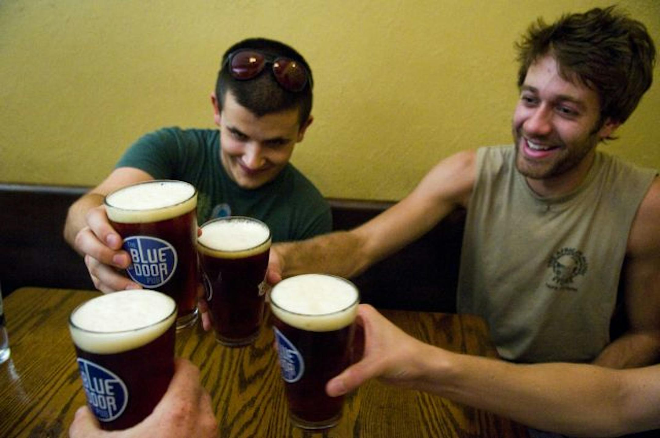 Theodore Salonek, left, and Jeff Hayes, both of St. Paul, enjoyed a round of Surly with friends.