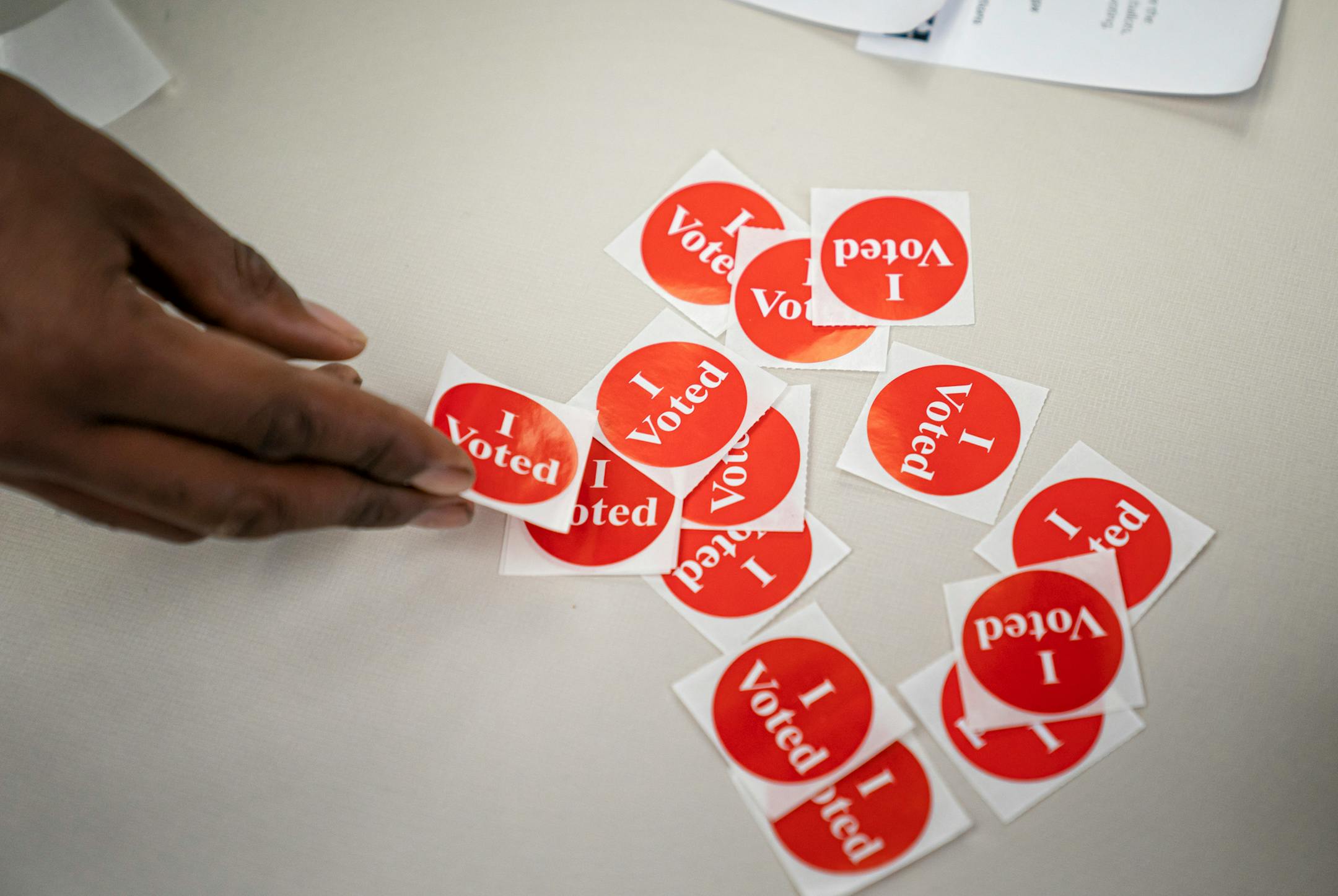 Victor Gaten put on an "I Voted" sticker after voting Wednesday at the Hennepin County Government Center. ] GLEN STUBBE • glen.stubbe@startribune.com Wednesday, October 21, 2020 Voting data analyzed by the Star Tribune finds voter turnout in the precincts with the highest concentration of Black voters dropped from 2012, when Barack Obama easily carried the state, to 2016, when Hillary Clinton nearly lost it. In a presidential election year that also saw a nationwide reckoning over race originate