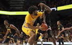 Gophers forward Jordan Murphy (3) turned to shoot while defended by Maryland Terrapins forward Jalen Smith (25). ] JEFF WHEELER &#x2022; jeff.wheeler@