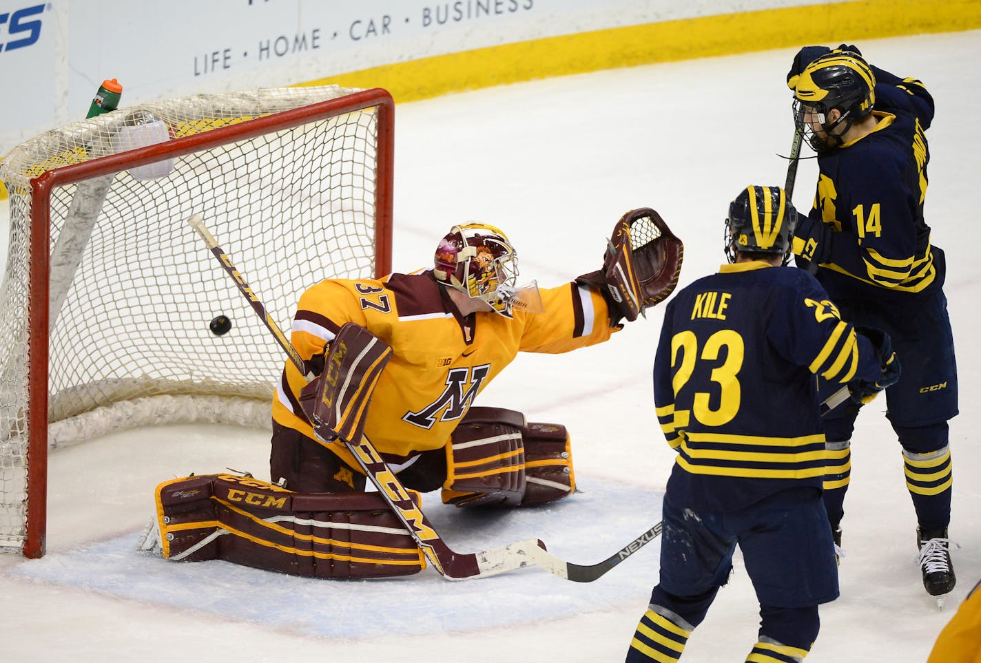 Michigan Wolverines forward Tyler Motte (14) scored a goal on Minnesota Golden Gophers goalie Eric Schierhorn (37) in the third period Saturday. ] (AARON LAVINSKY/STAR TRIBUNE) aaron.lavinsky@startribune.com The University of Minnesota Golden Gophers men's hockey team played the University of Michigan Wolverines in the Big Ten Tournament championship game on Saturday, March 19, 2016 at Xcel Energy Center in St. Paul, Minn.