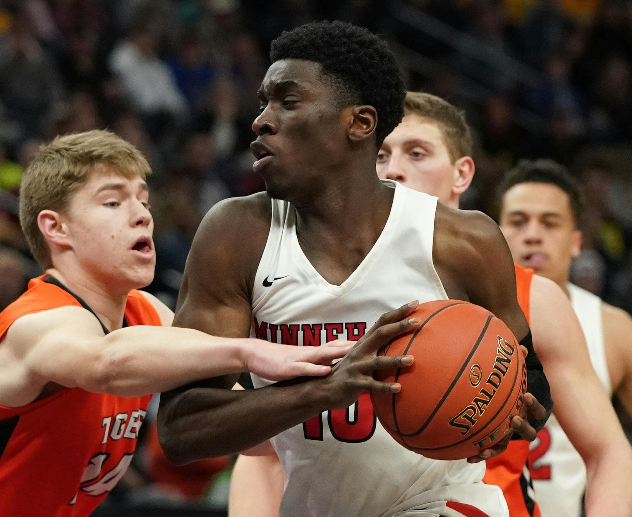 Minnehaha forward Prince Aligbe (10) drove to the basket as Lake City guard Justin Wohlers (14) reached out to defend in the second half. ] ANTHONY SOUFFLE • anthony.souffle@startribune.com Minnehaha Academy played Lake City High School in an MSHSL Class 2A boys' semifinal basketball game Friday, March 22, 2019 at the Target Center in Minneapolis.