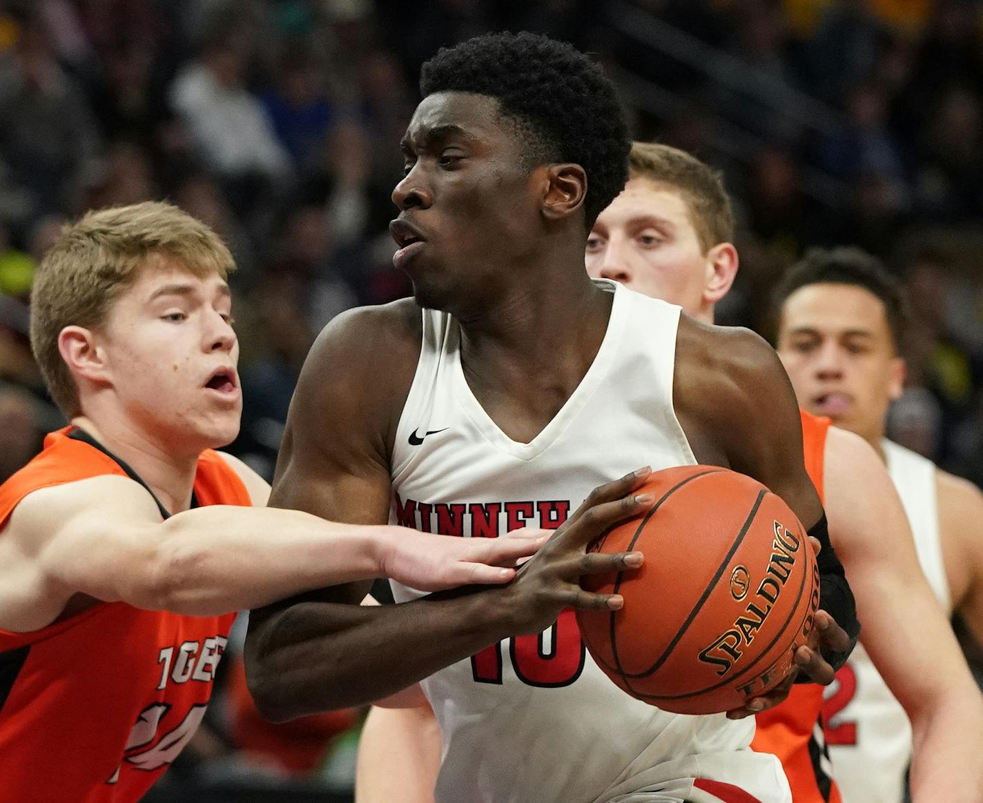 Minnehaha forward Prince Aligbe (10) drove to the basket as Lake City guard Justin Wohlers (14) reached out to defend in the second half. ] ANTHONY SOUFFLE &#x2022; anthony.souffle@startribune.com Minnehaha Academy played Lake City High School in an MSHSL Class 2A boys' semifinal basketball game Friday, March 22, 2019 at the Target Center in Minneapolis.