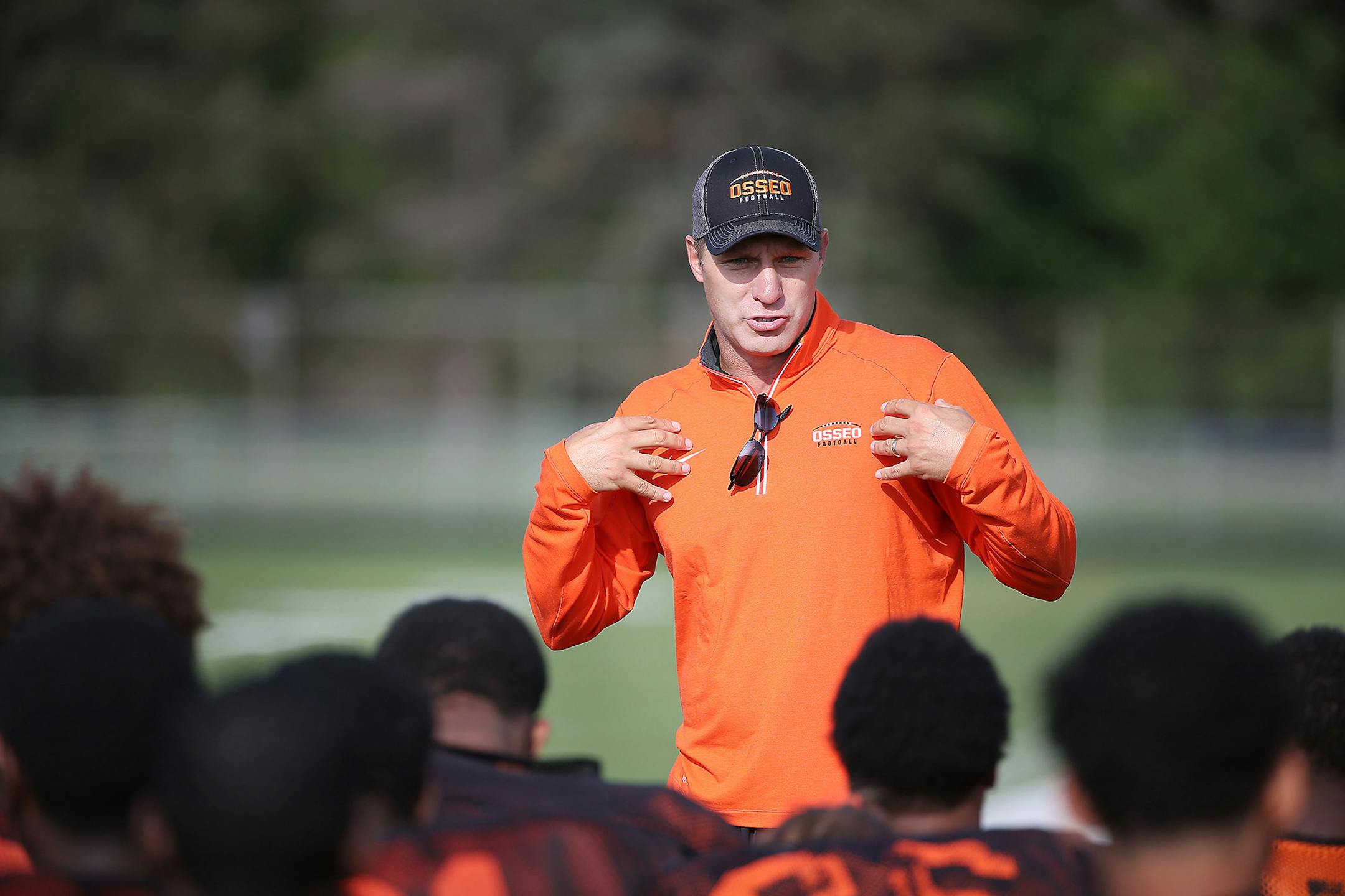 Osseo coach Derrin Lamker gave a pep talk before practice prior to the start of last season. The Orioles won the Class 6A Prep Bowl, but Lamker will not return. He's taken a job at Edina. (Elizabeth Flores, Star Tribune)