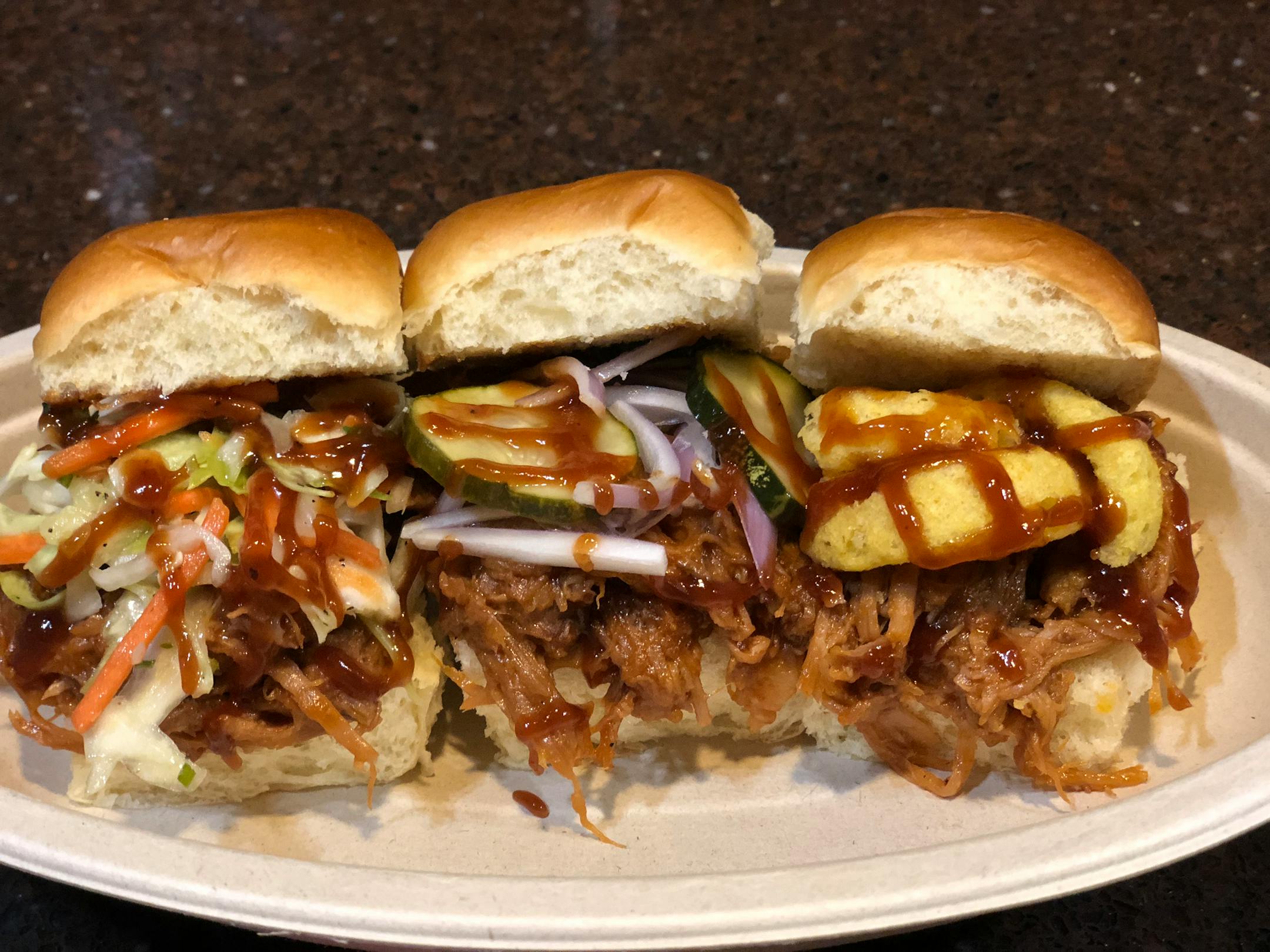 Slider Flights: Flights of three slider sandwiches, each with a variety of toppings, available in three varieties:
• Brisket Flight: One slider topped with coleslaw, one with pickles and onions, and one with crispy fried onions
• Burger Flight: One slider topped with thick-cut candied bacon and cheddar cheese, one with smoked gouda, and one with BBQ sauce, pepper jack cheese and crispy fried onions
• Pulled-Pork Flight: One slider topped with coleslaw, one with pickles and onions, and one with c