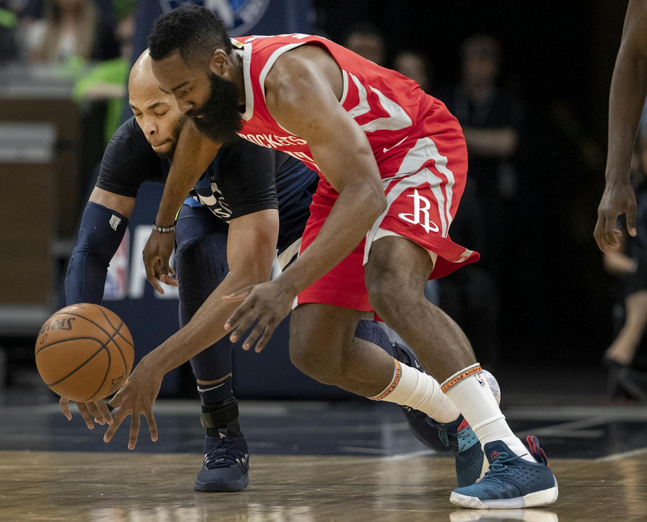 Minnesota Timberwolves Taj Gibson (67) and James Harden (13) fought for the ball in the first quarter.