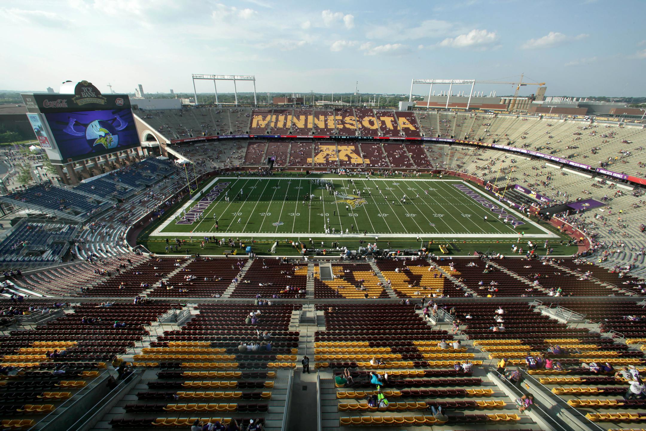 The Minnesota Vikings and the Oakland Raiders warmup before a preseason NFL football game at TCF Bank Stadium in Minneapolis, Friday, Aug. 8, 2014. The Vikings will be spending the next two seasons at the outdoor stadium, home of the University of Minnesota, until their new stadium opens. (AP Photo/Paul Sancya)