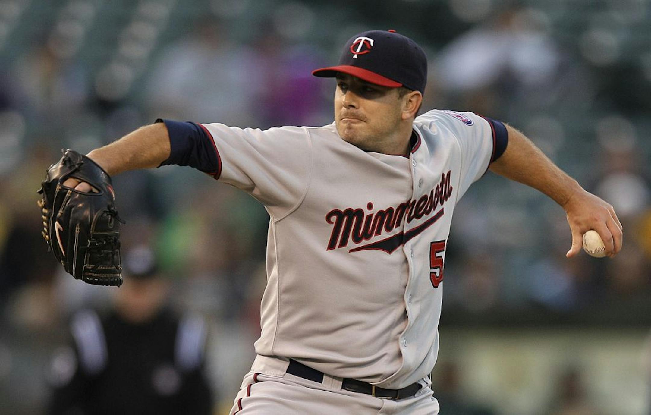Minnesota Twins' Brian Duensing works against the Oakland Athletics in the first inning of a baseball game, Monday, Aug. 20, 2012, in Oakland, Calif.