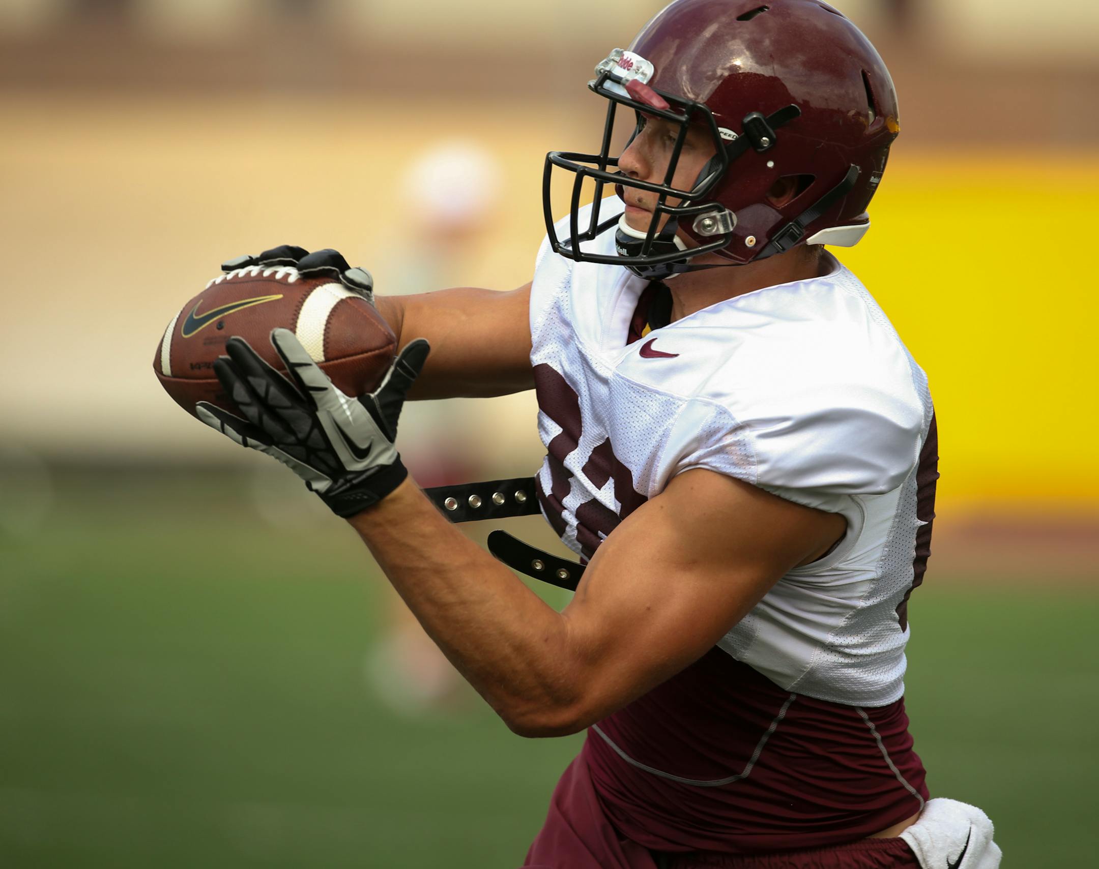 Sophomore wide receiver Drew Wolitarsky caught a short pass during drills Monday evening in Minneapolis. ] JEFF WHEELER • jeff.wheeler@startribune.com The Gophers held an open football practice Monday evening, August 4, 2014 at the Gibson-Nagurski Football Complex on the Minneapolis campus.