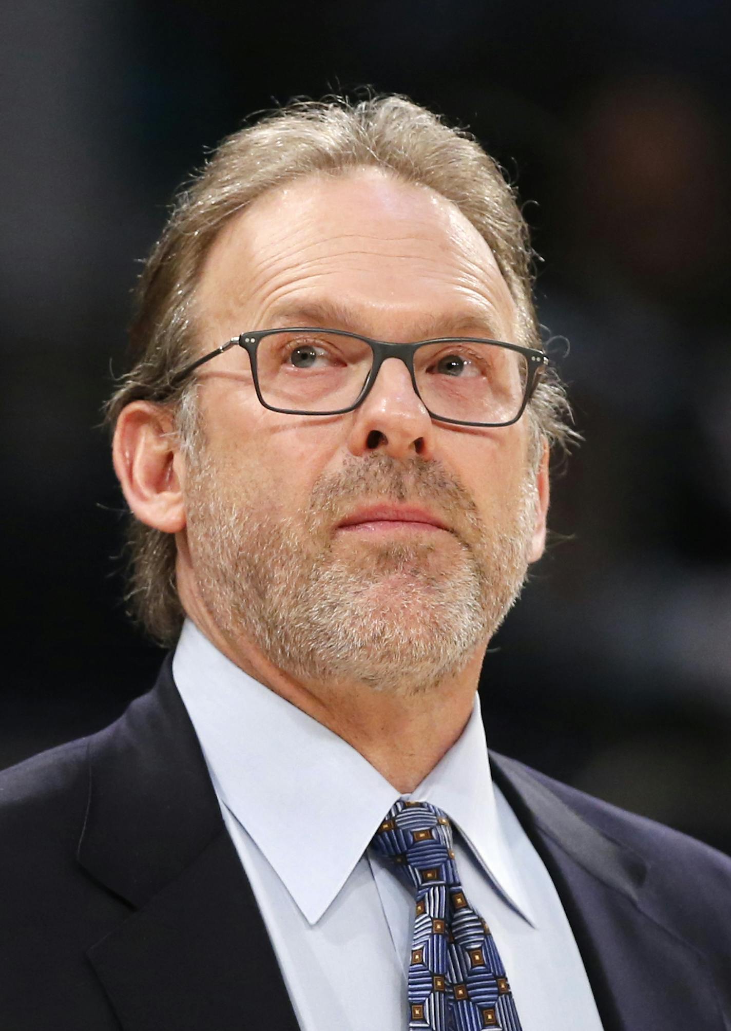 New York Knicks interim head coach Kurt Rambis, coaching his first game in place of Derel Fisher, who's was fired Monday, stands watches from the bench in the first half of an NBA basketball game between the New York Knicks and the Washington Wizards at Madison Square Garden in New York, Tuesday, Feb. 9, 2016. (AP Photo/Kathy Willens)