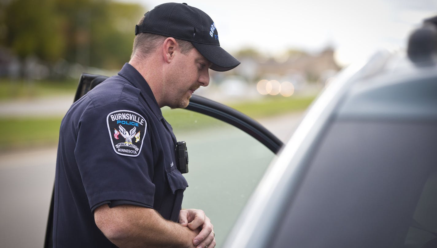 Officer Shaun Anselment wore a body camera on his chest as he pulled someone over on a traffic stop on patrol on Monday, October 21, 2013, in Burnsville, Minn. This is the third year the Burnsville Police Department has used these body cameras.] RENEE JONES SCHNEIDER &#x2022; reneejones@startribune.com