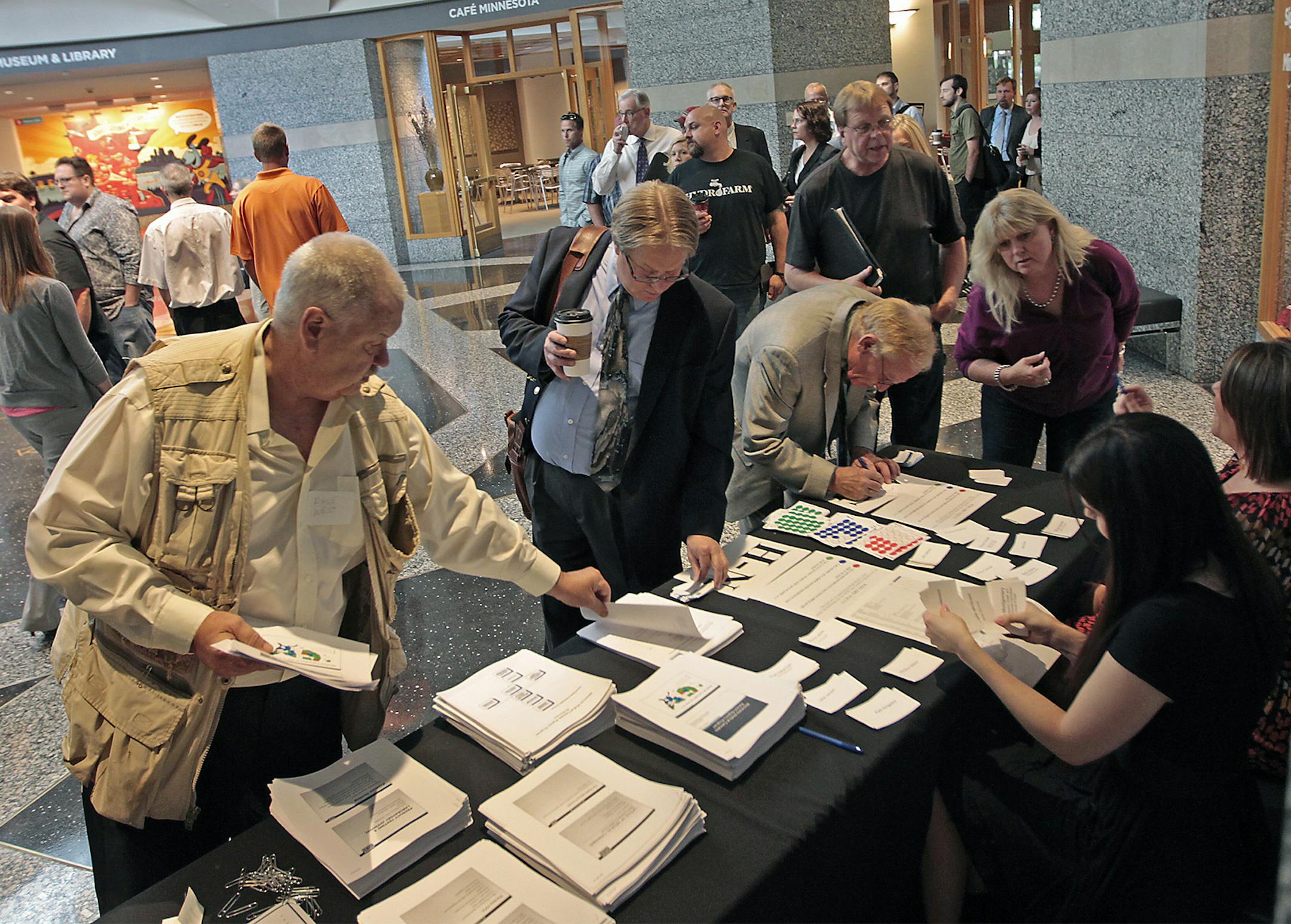 Would-be pot entrepreneurs crowded into the Minnesota History Center for an informational meeting and hoping to be one of the two manufacturers the Health Department will choose to produce all of Minnesota's medical cannabis, Friday, August 8, 2014 in St. Paul, MN. ] (ELIZABETH FLORES/STAR TRIBUNE) ELIZABETH FLORES • eflores@startribune.com