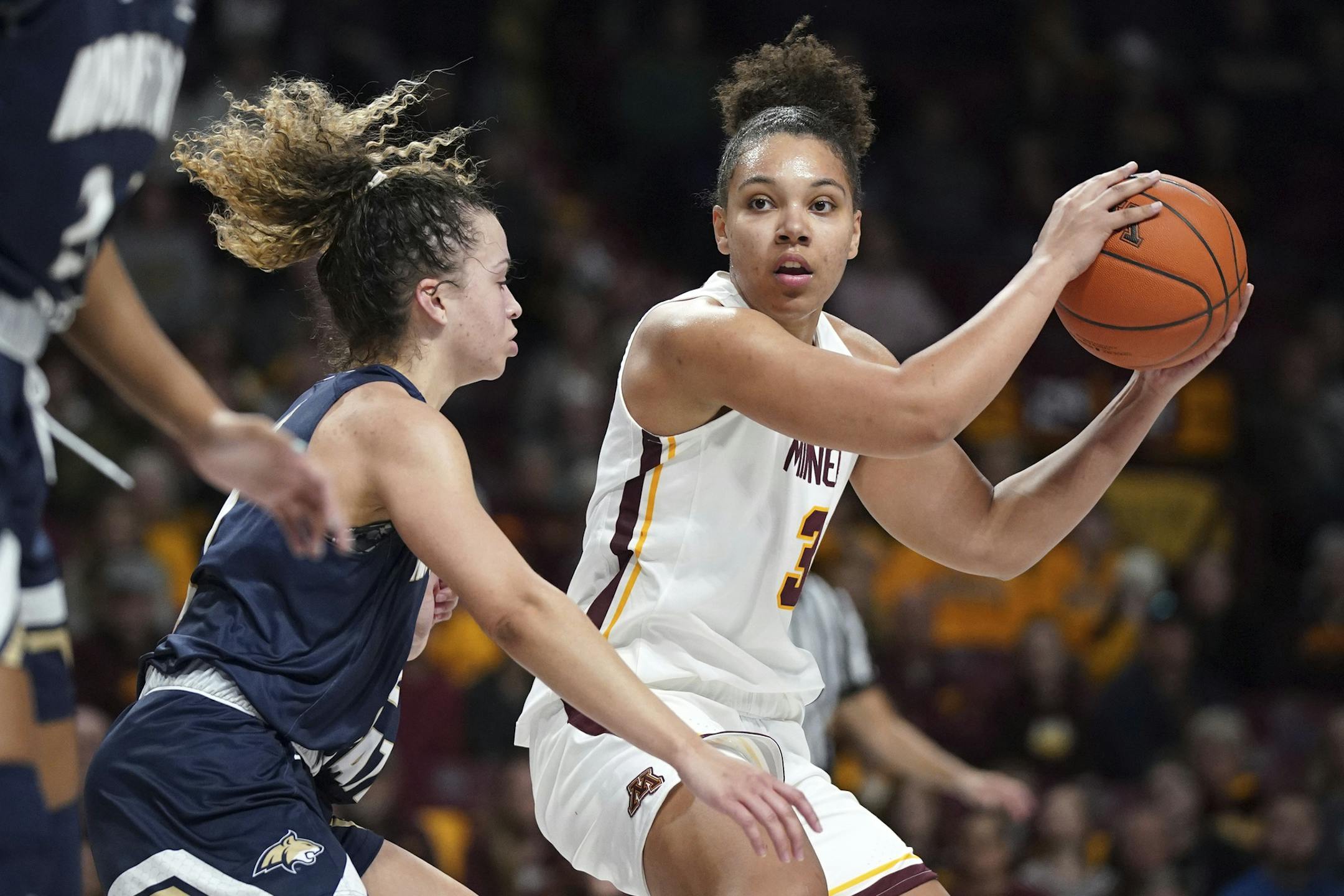 In this Nov. 23, 2019, photo, Minnesota guard Destiny Pitts (3) lookesto pass the ball as Montana State guard Darian White (2) defends during an NCAA college basketball game in Minneapolis. Pitts said Thursday, Jan. 16, she is transferring after the Gophers suspended her for unspecified “conduct unbecoming a member of the team.” (Anthony Souffle/Star Tribune via AP) ORG XMIT: MER49bd42e2643ec8d87963c54dac383