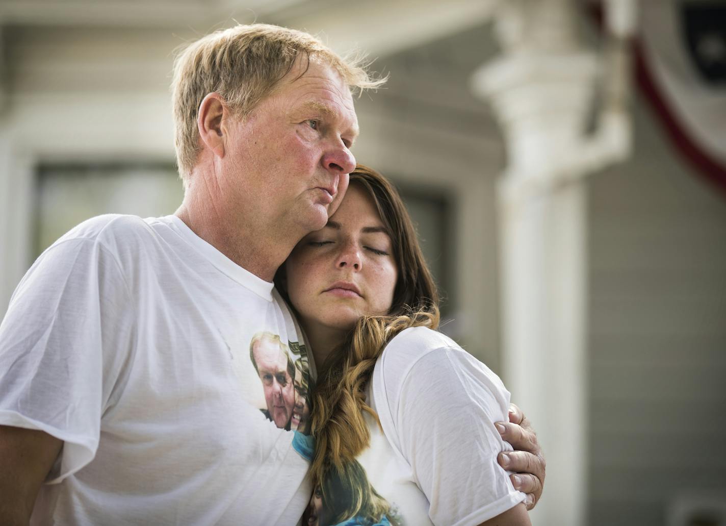 Jerome Hanson hugs his daughter Amanda Weigand during a memorial for his other daughter Jessica Hanson in Minneapolis. ] (Leila Navidi/Star Tribune) leila.navidi@startribune.com BACKGROUND INFORMATION: The family of Jessica Hason, 24, a cyclist who was hit and killed by a motorist at 28th Street and Pleasant Avenue in Minneapolis three years ago, holds a memorial for Jessica where she was killed on Tuesday, July 19, 2016. The driver will be sentenced today.