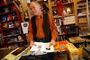 Brian Baxter worked behind the counter at the Birchbark bookstore in Minneapolis recently. Baxter, a well known personality at the store, is retiring 