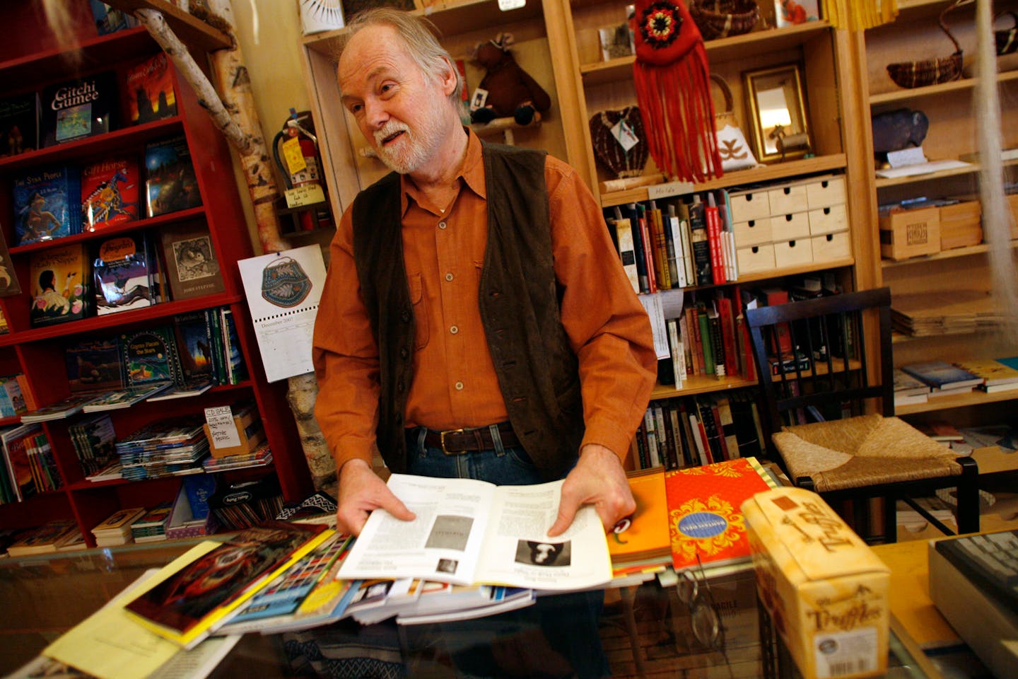 Brian Baxter worked behind the counter at the Birchbark bookstore in Minneapolis recently. Baxter, a well known personality at the store, is retiring this week.