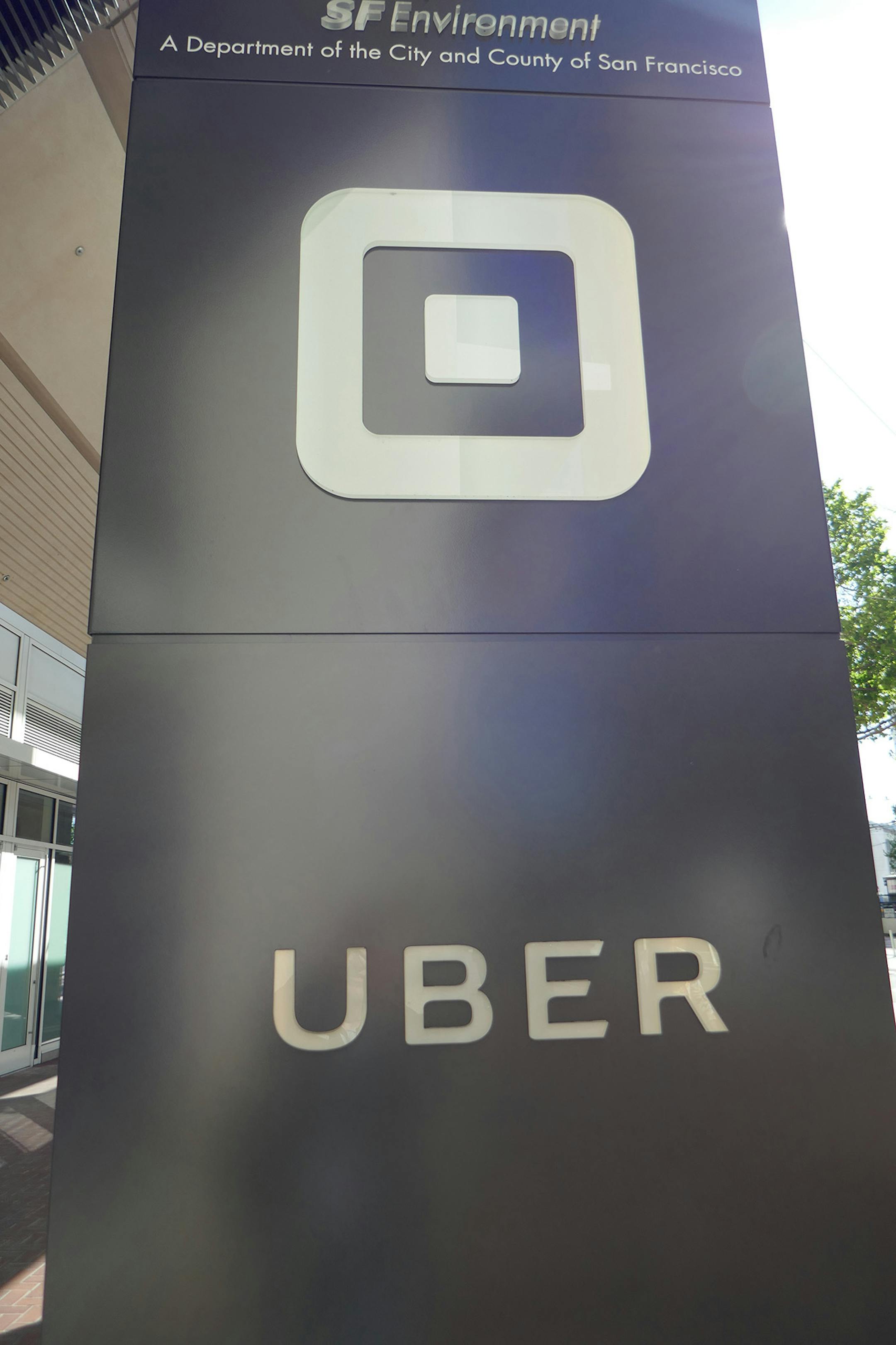 The logo of peer-to-peer ridesharing provider Uber at the company's headquarters on May 7, 2018 in San Francisco, Calif. Uber has laid off about 400 employees globally. (Christoph Dernbach/DPA/Zuma Press/TNS) ORG XMIT: 1375601