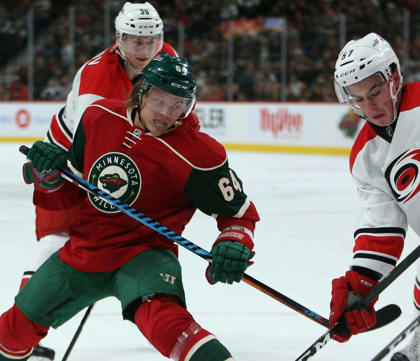 Wild center Mikael Granlund battled Hurricanes center Andrew Poturalski for the puck during the first period. ] Mark Vancleave - mark.vancleave@startribune.com * The Carolina Hurricanes played the Minnesota Wild on Sunday, Oct. 2, 2016 at the Xcel Energy Center in St. Paul, Minn.