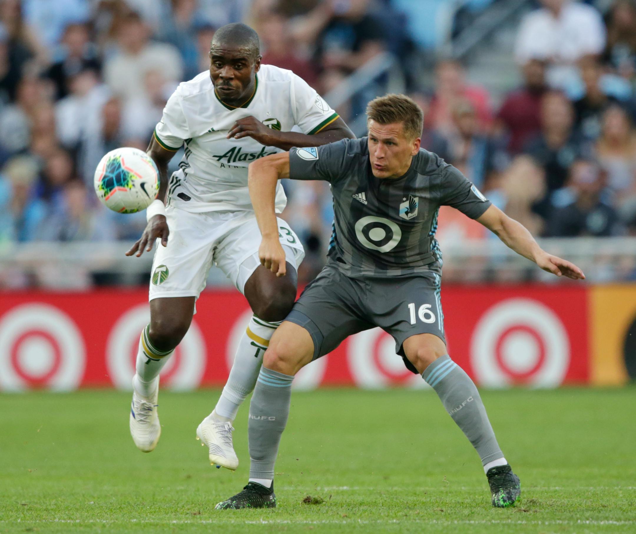 Portland Timbers defender Larry Mabiala and Minnesota United midfielder Robin Lod