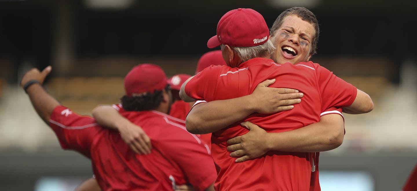 Henry Sibley head coach Greg Fehrman was hugged by James Lee after the Warriors defeated the Zephyrs Monday evening. ] JEFF WHEELER &#x2022; jeff.wheeler@startribune.com Henry Sibley defeated Mahtomedi 8-4 to win the Class 3A Minnesota State High School League baseball tournament championship game Monday afternoon, June 20, 2016 at Target Field in Minneapolis.