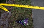 A bouquet of flowers placed by police tape near Marjory Stoneman Douglas High School, the day after a shooting there, in Parkland, Fla., Feb. 15, 2018