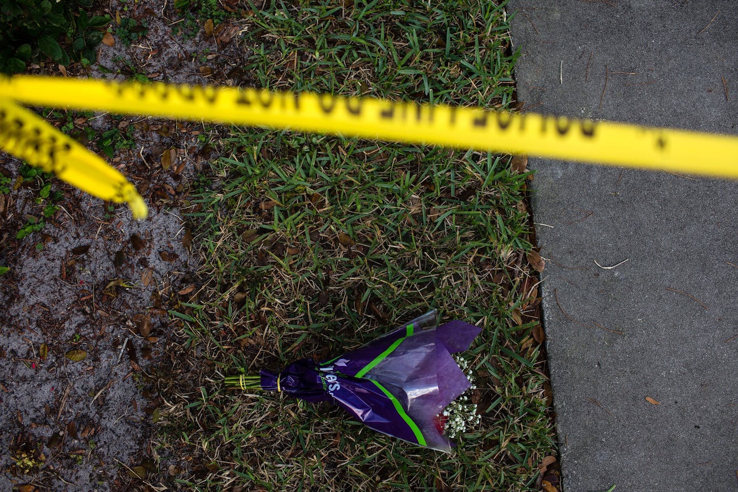 A bouquet of flowers placed by police tape near Marjory Stoneman Douglas High School, the day after a shooting there, in Parkland, Fla., Feb. 15, 2018. Authorities on Thursday charged 19-year-old Nikolas Cruz &#x2013; who is suspected of gunning down students and adults at the school &#x2013; with 17 counts of premeditated murder. (Saul Martinez/The New York Times)