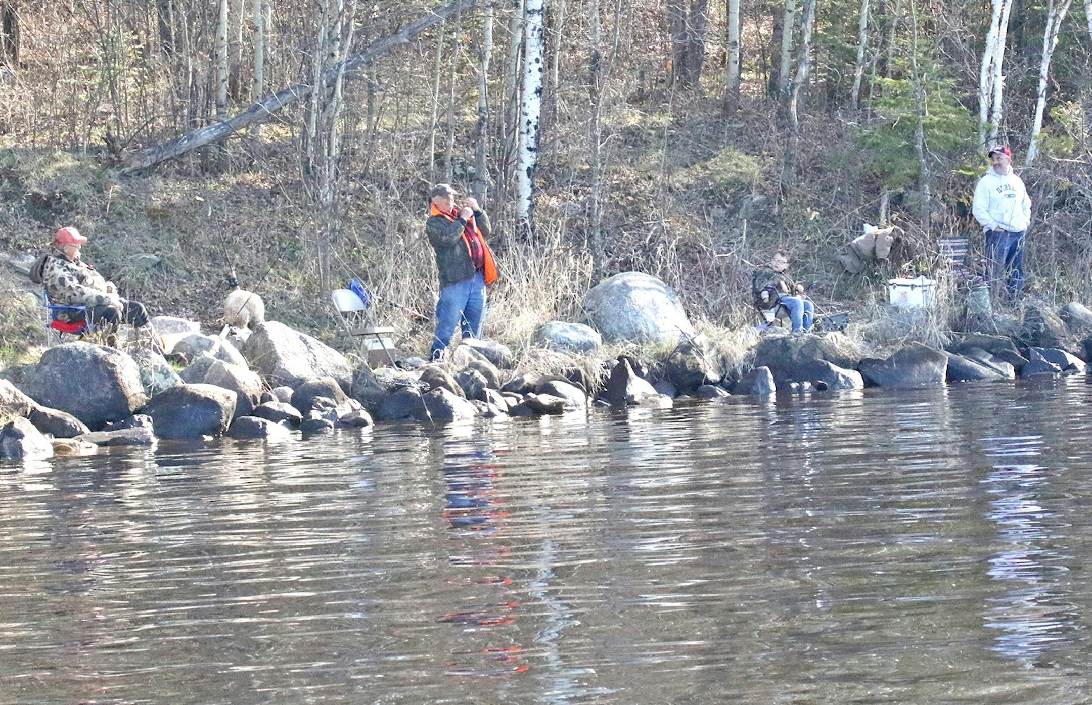 An angler fishing from the shore of Hoodoo Point on Lake Vermilion's eastern half lifts up on his rod in hopes of hooking a walleye. The campground owned by the City of Tower is an annual hotspot on Opening Day for anglers who like to camp and fish from shore