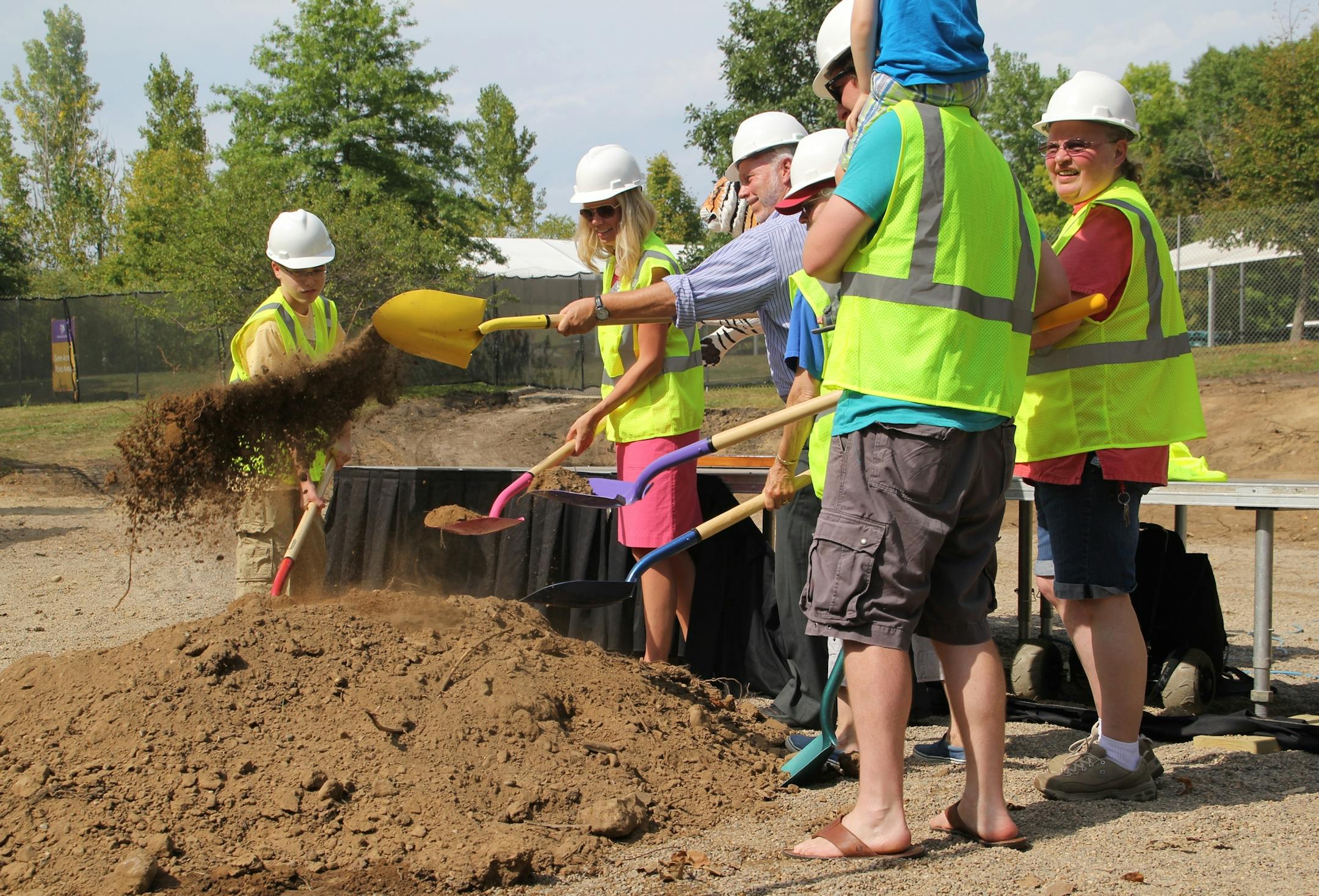 Courtesy Minnesota Zoo Minnesota Zoo Director/CEO Lee Ehmke, center, along with zoo supporters, broke ground last month on Conservation Carousel, scheduled to open in 2014.