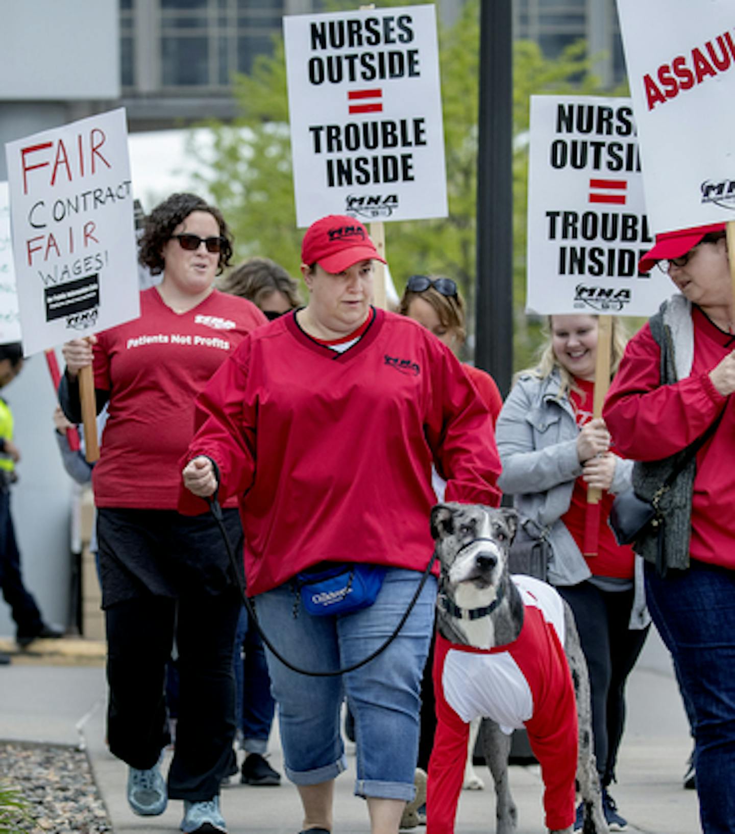 Minneapolis Children's Hospital nurse Pamala Trowbridge, and her dog "Frankie" joined other nurses and their supporters as they picketed on the sidewalk outside Children's St. Paul and United Hospital last month.