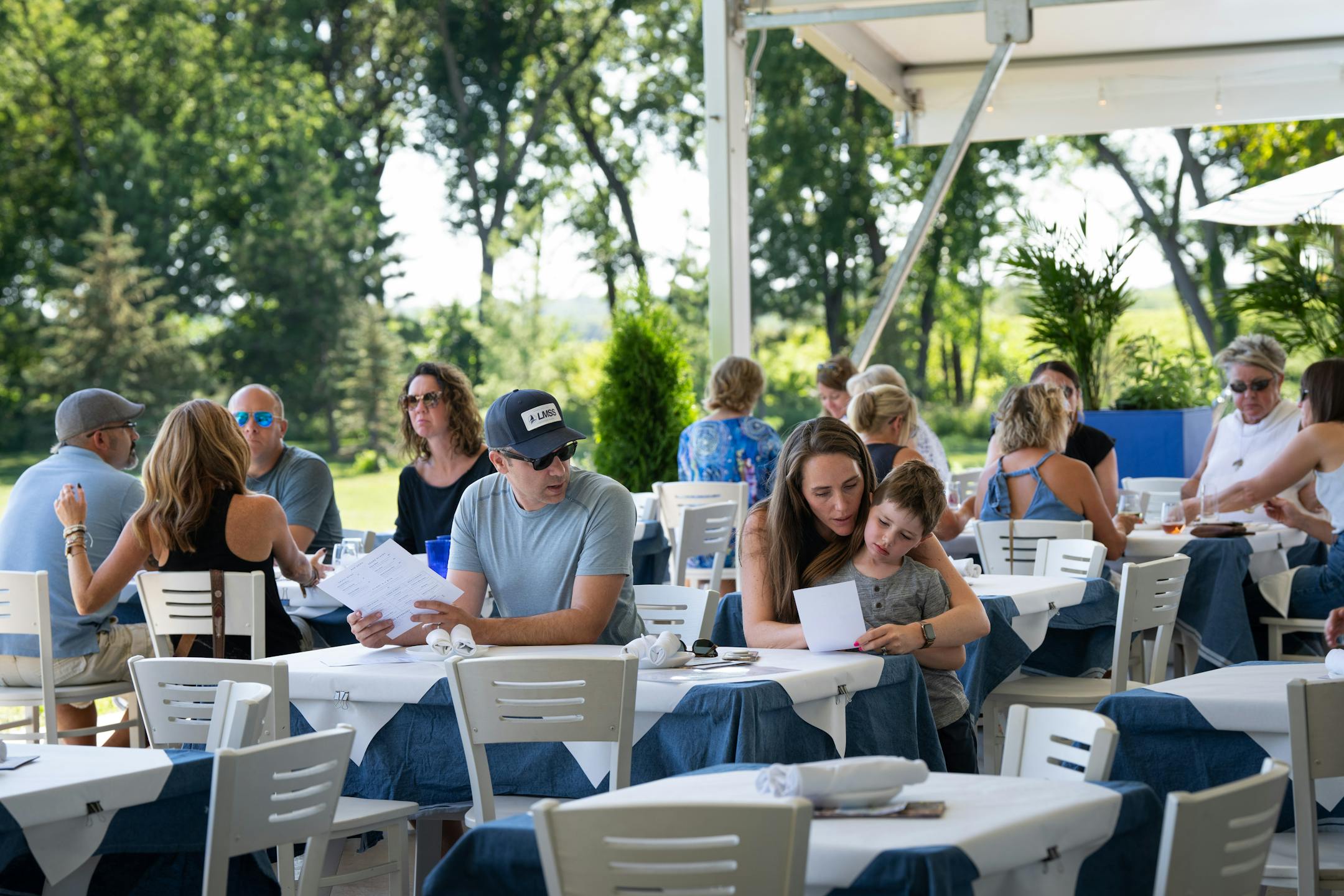 Hayley Hontos snuggles up to her son Ari, 5, to help him order at Gia at the Lake.