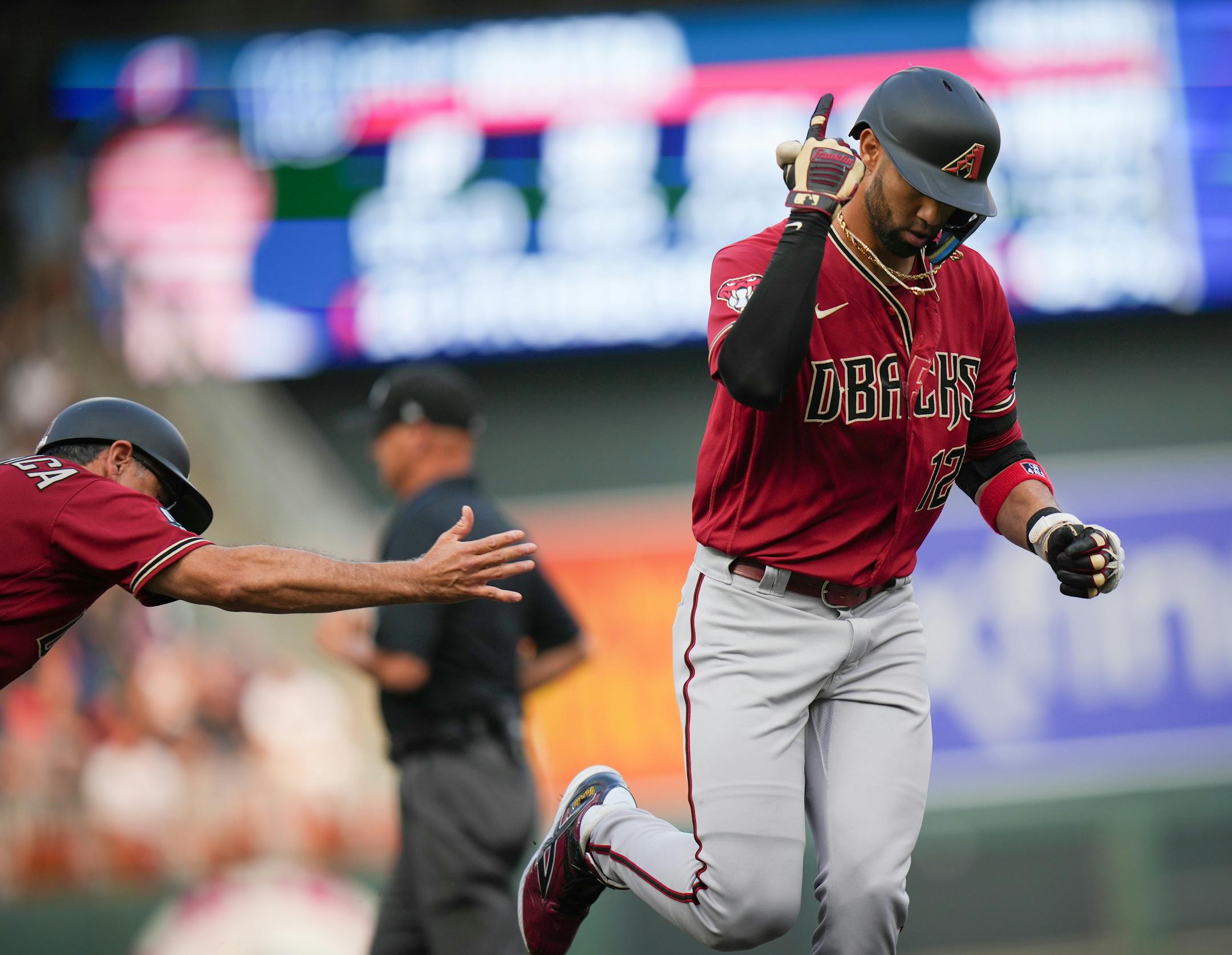Arizona Diamondbacks left fielder Lourdes Gurriel Jr. (12) rounds third base after hitting a solo homerun off Minnesota Twins starting pitcher Kenta Maeda (18) in the second inning.