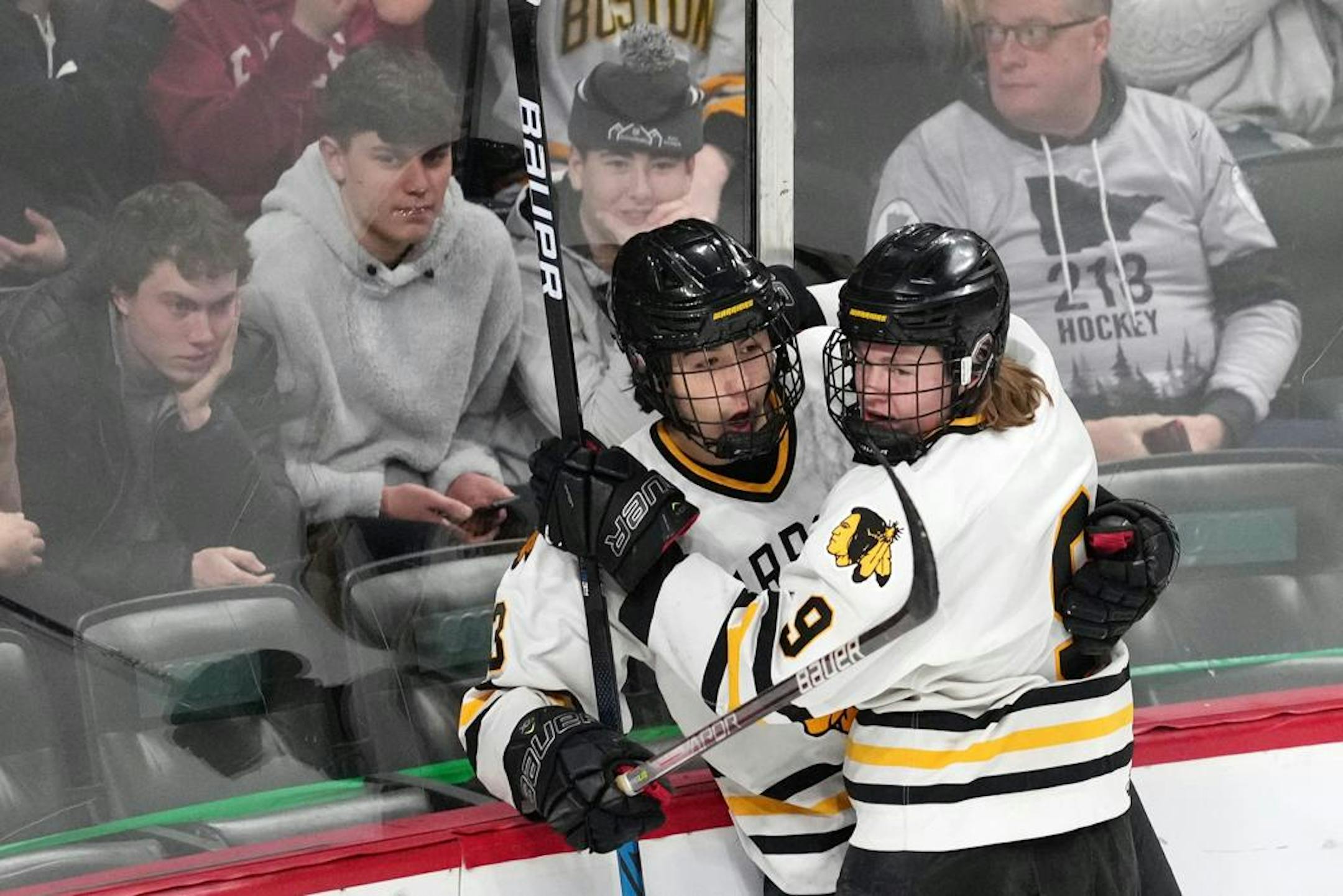 Warroad forward Daimon Gardner (13) celebrates with forward Matthew Hard (9) after scoring in the first period of a MSHSL Class 4A semifinal boys hockey game between Warroad and Mahtomedi Friday, March 11, 2022 at the Xcel Energy Center in St. Paul, Minn. . ] ANTHONY SOUFFLE • anthony.souffle@startribune.com