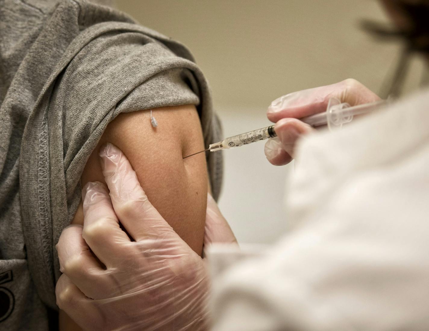 A nurse practitioner at a Target clinic in Roseville administered a flu shot to a 15-year-old boy.