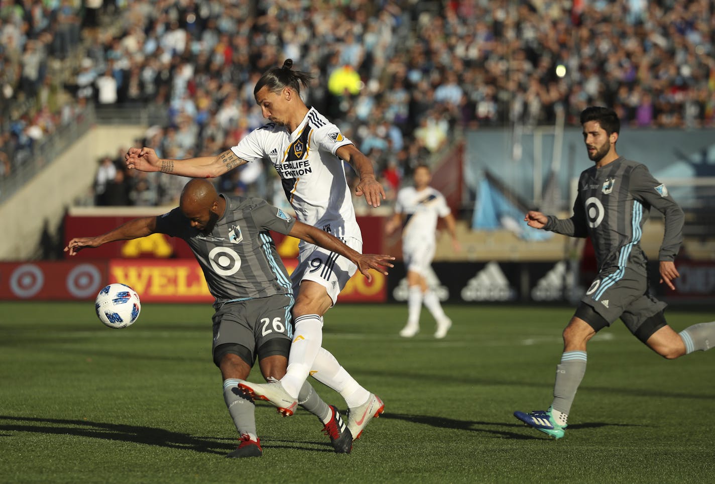 Los Angeles Galaxy forward Zlatan Ibrahimovic (9) was defended by Minnesota United midfielder Collen Warner (26) in the first half. ] JEFF WHEELER &#x2022; jeff.wheeler@startribune.com The Minnesota United FC faced the Los Angeles Galaxy in their last home game of the season and their final game at TCF Bank Stadium Sunday afternoon, October 21, 2018 in Minneapolis.