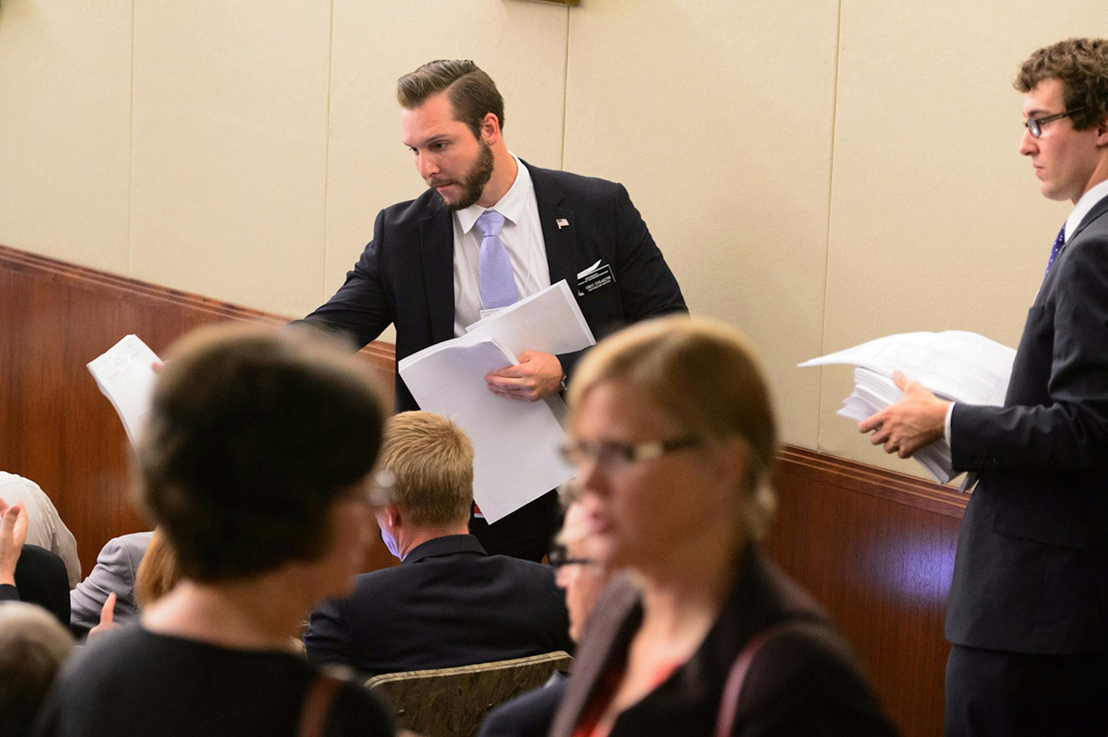 Legislative assistant Chris Stolarzyk passed out copies of the Legacy funding bill in the House.