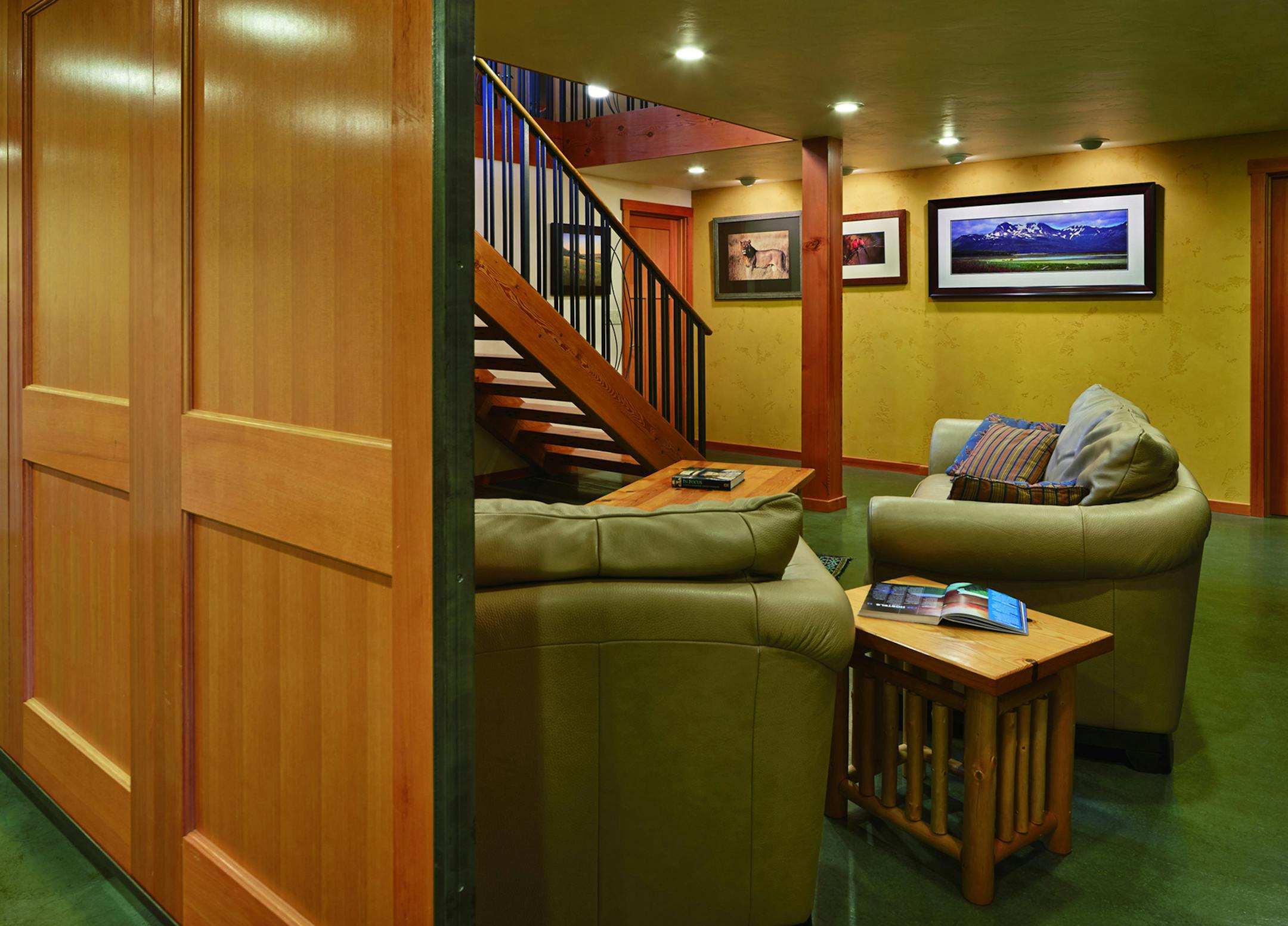 Tour the house that Craigslist built. The stairs to the family room are fir from beams in a South Lake Union warehouse. Two beams were enough for 14 steps and runners, 3 inches thick. The doors on the left close off the kids' play room. They're fir doors that fell off a truck (really!) and were refashioned into barn-door sliders. (Benjamin Benschneider/Seattle Times/MCT)