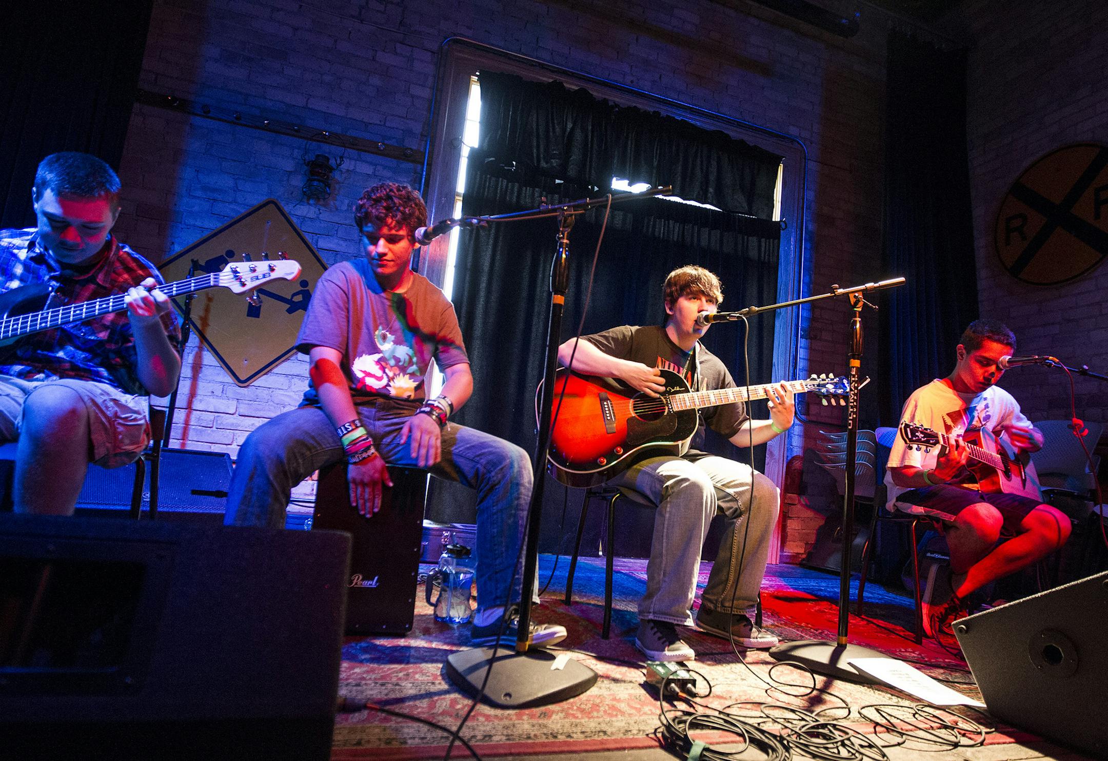 Eric Peixoto, second from left, performs with his band Ithomiid at The Depot Coffee House in Hopkins July 25, 2014. (Courtney Perry/Special to the Star Tribune)