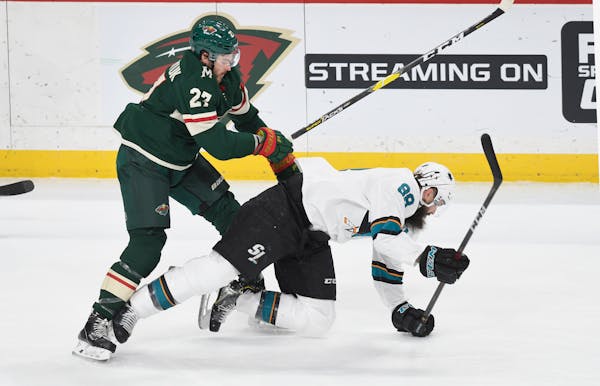 For Wild winger Alex Galchenyuk (left, leveling the Sharks' Brent Burns on Saturday) there wasn't a chance to practice with his new squad of a trade b