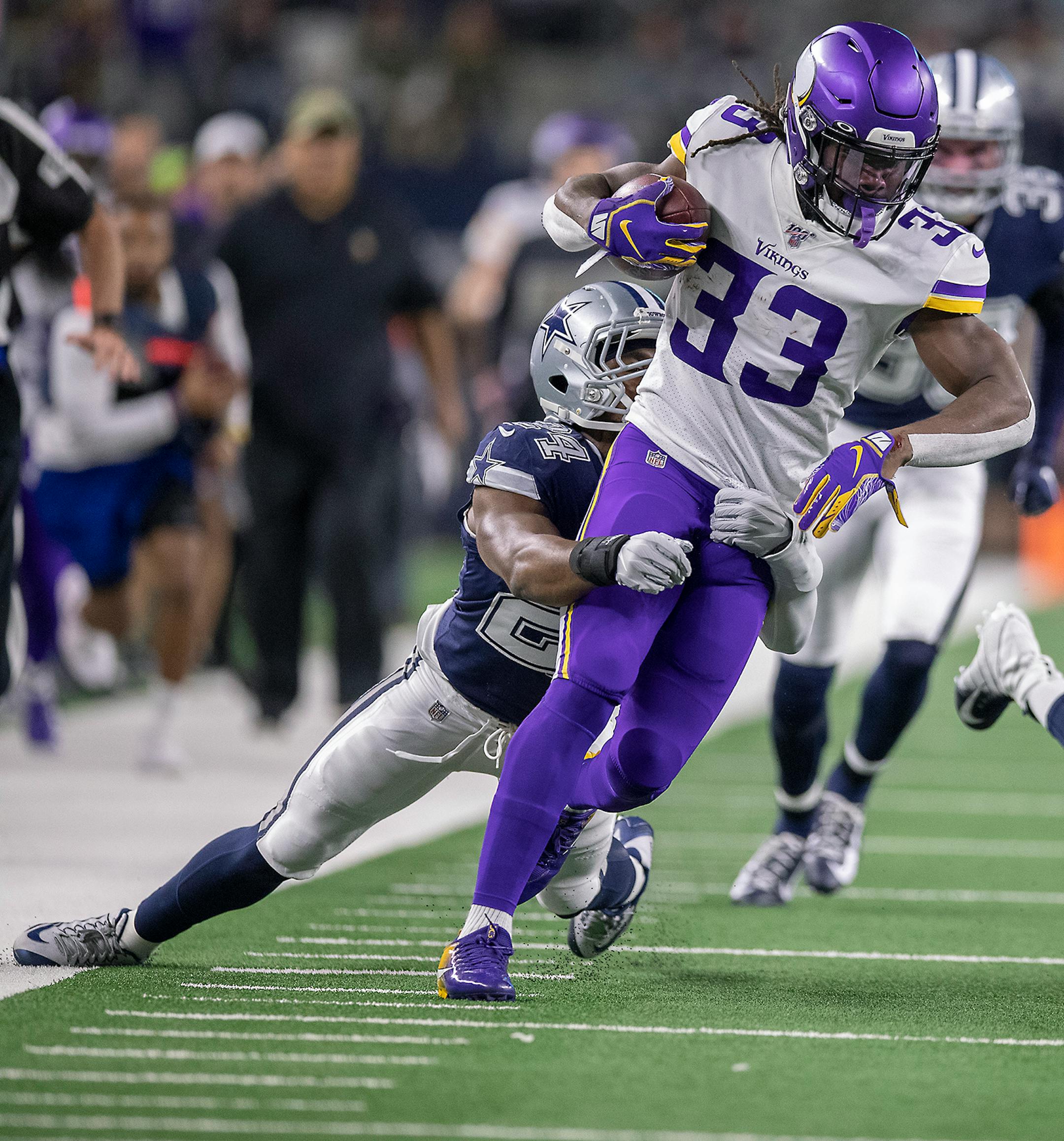 Dallas Cowboys cornerback Chidobe Awuzie held onto Minnesota Vikings running back Dalvin Cook before he was called with a facemark penalty on during the first quarter.