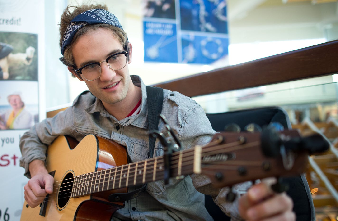 Pete Ford tunes his guitar before practicing a song he just wrote for a couple Thursday afternoon. ] AARON LAVINSKY &#x2022; aaron.lavinsky@startribune.com Pete Ford recently opened a kiosk at Ridgedale Center called the Serenade Store. He writes personalized songs for people as gifts. Ford was photographed at his kiosk Thursday, Dec. 4, 2014 in Minnetonka.