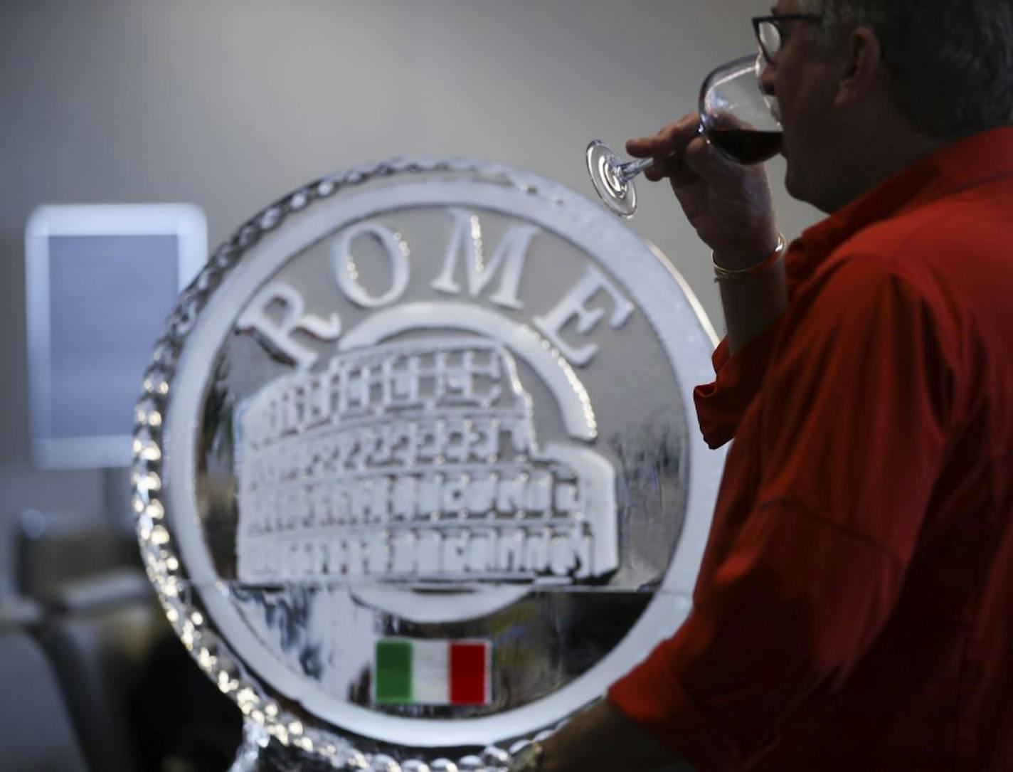 Complimentary red wine was served in the gate area to commemorate Delta's first flight to Rome Wednesday afternoon. There were also meatballs and garlic bread from Buca and cake and cannelloni.