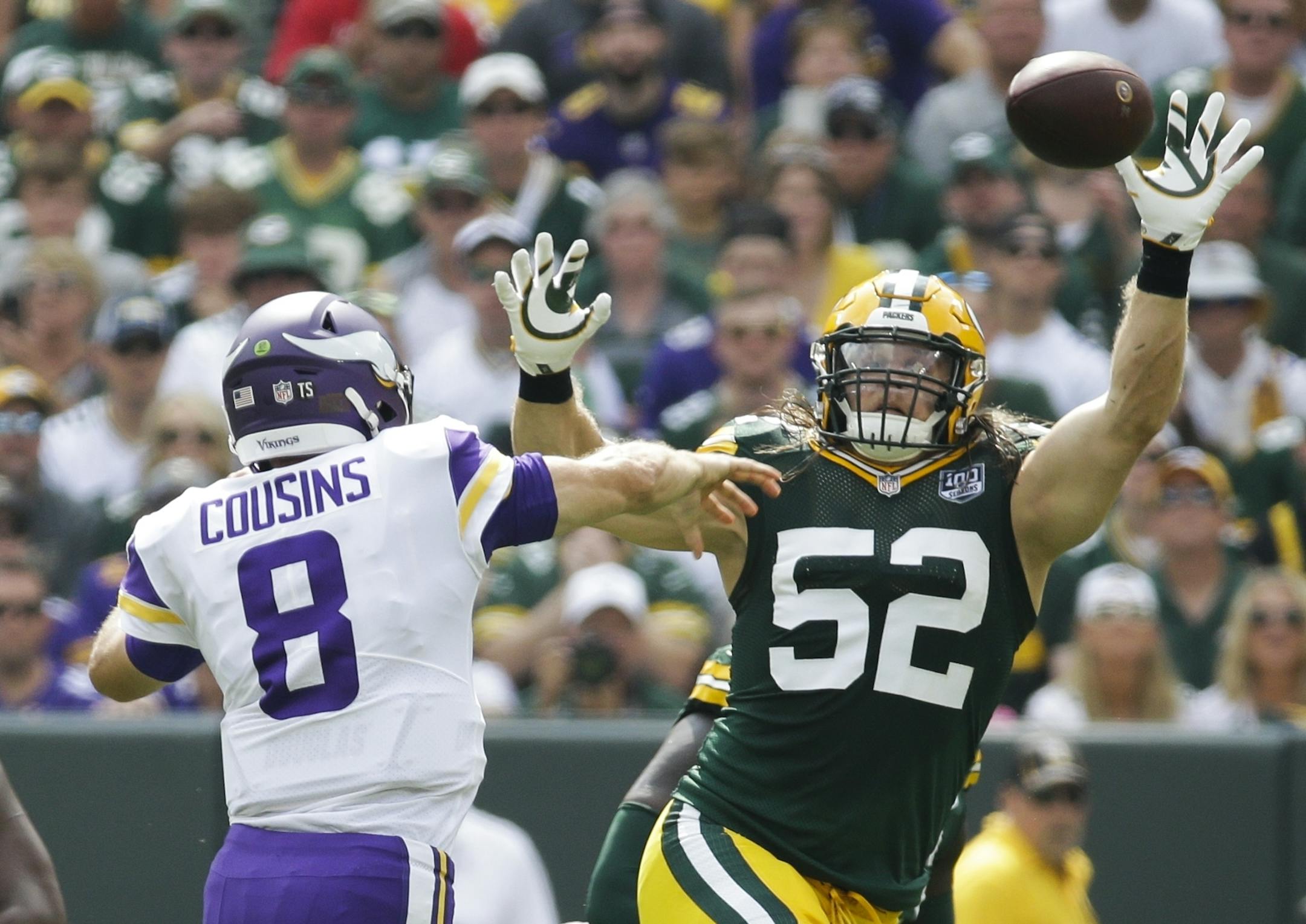 Minnesota Vikings' Kirk Cousins throws over Green Bay Packers' Clay Matthews during the first half of an NFL football game Sunday, Sept. 16, 2018, in Green Bay, Wis. (AP Photo/Mike Roemer)