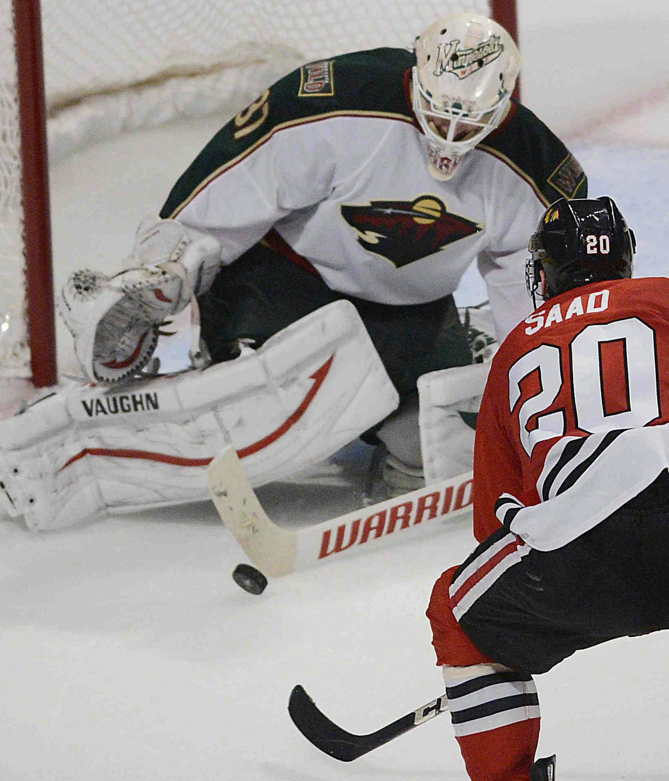 Minnesota Wild goalie Josh Harding defends the net against Chicago Blackhawks left wing Brandon Saad in the third period in Game 1 of an NHL hockey Stanley Cup playoff series Tuesday, April 30, 2013, in Chicago. The Blackhawks defeated the Wild 2-1. (AP Photo/Daily Herald, John Starks )